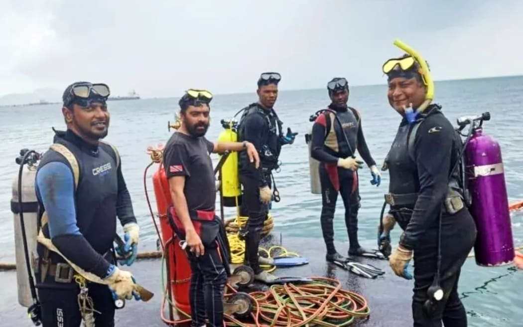 Photo of some of the professional divers who were sucked into a 75cm-bore oil pipeline off the Caribbean island of Trinidad in early 2022