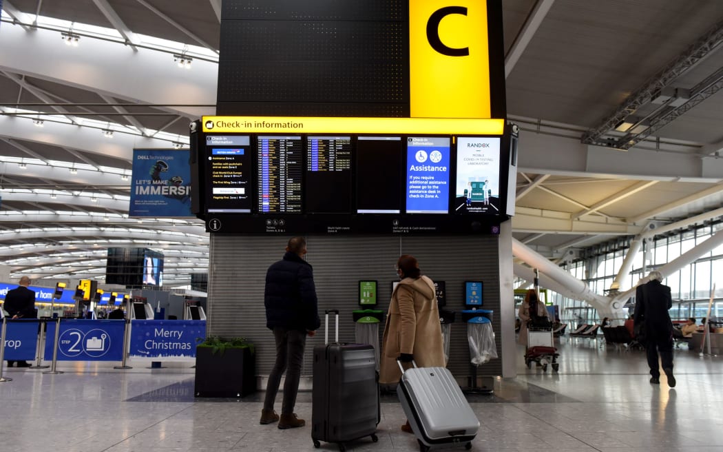 Travellers at an almost deserted departures hall at Terminal 5 of Heathrow Airport in west London on December 21, 2020, as a string of countries around the world banned travellers arriving from the UK.