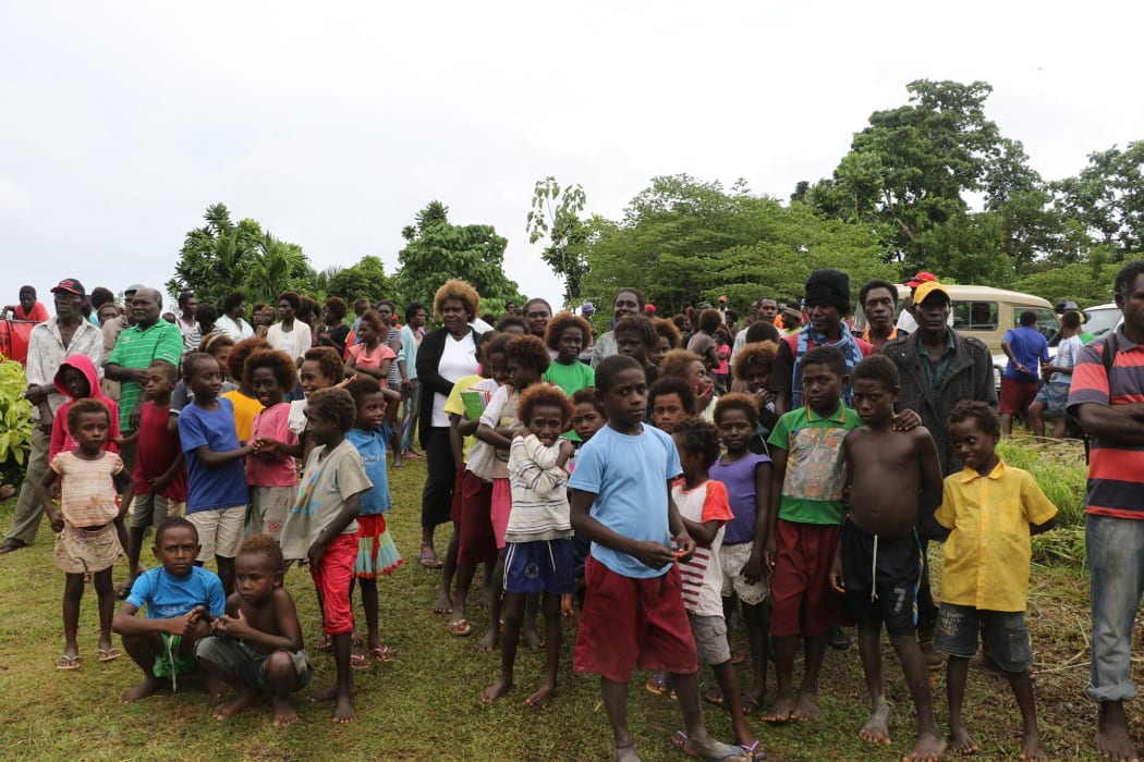 A crowd of people in Bougainville watching the handover of the agreed definitions for the two questions for the Independence Referendum. The first Greater Autonomy for Bougainville and the other full Independence from Papua New Guinea.