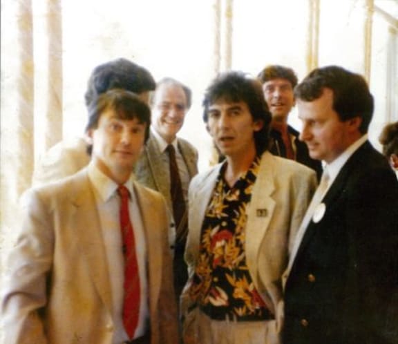 George Harrison w. Wayne Mowat, Blackie and others during Alistair Taylor book promo tour of NZ