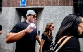 Golriz exiting court.