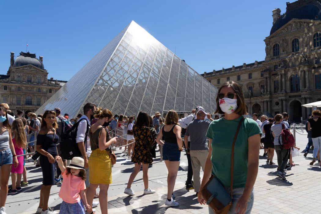 Visitors queuing to enter the Louvre Museum, Paris.