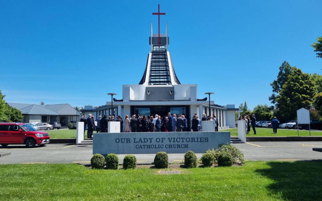Guests leave the memorial service for Yanfei Bao who was killed last year. A man is currently on trial accused of her murder.