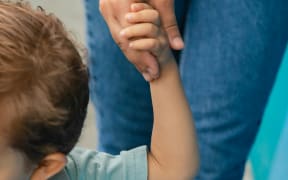 Parent taking their child to school.