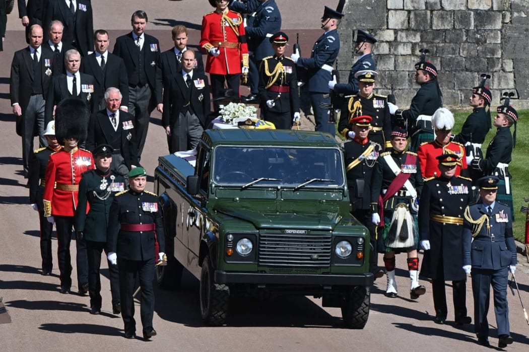 The modified Land Rover hearse carries the coffin as members of the Royal Family follow behind during the ceremonial funeral procession of Britain's Prince Philip, Duke of Edinburgh to St George's Chapel in Windsor Castle in Windsor, west of London, on April 17, 2021.