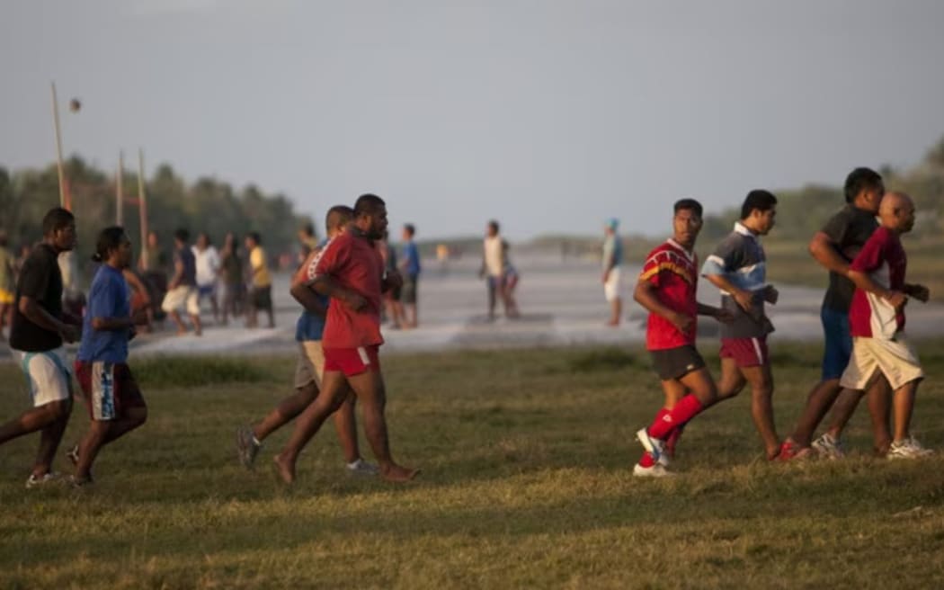 Tuvaluans play sports on and beside the runway at Funafuti International Airport. Photo/Oxfam Australia.