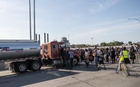 A large group of protesters had been marching over the bridge on both lanes before a truck drove into the crowd.