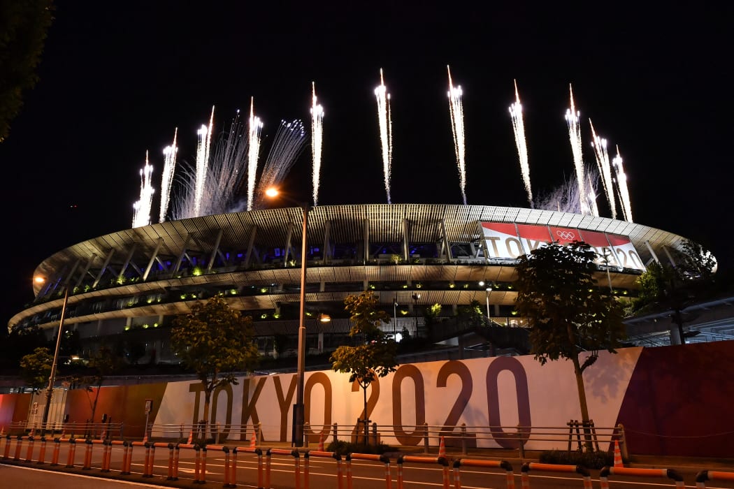Fireworks go off around the Olympic Stadium during the closing ceremony of the Tokyo 2020 Olympic Games.