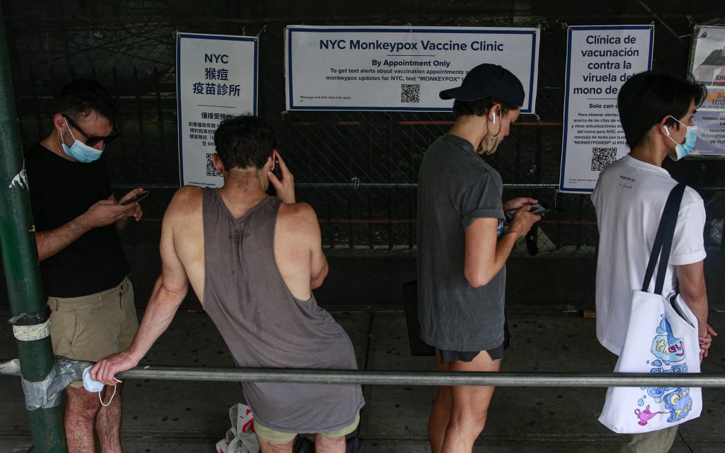 People wait in line for a monkeypox vaccine on 17 July 2022 at a new mass vaccination site in New York City.