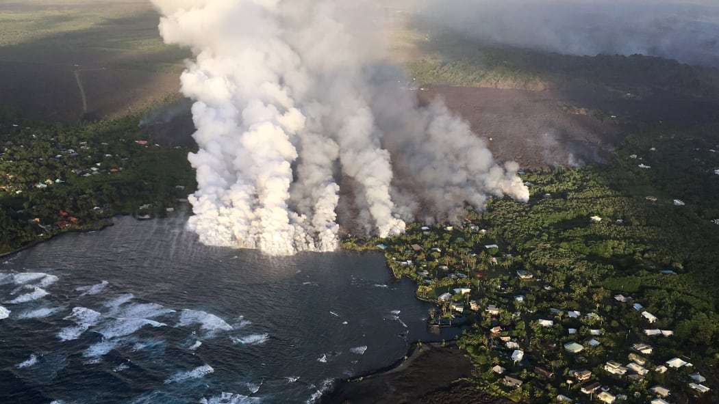 Lava flowing form Kilauea Volcano enters Kapoho Bay, engulfing housing areas in its path (4 June) 4 June 2018.