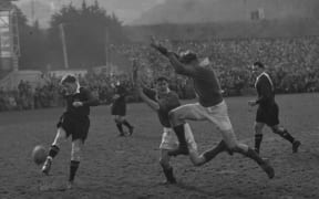 Buller players Max Ryan and Bob Hawes attempt to charge down an Otago kick.