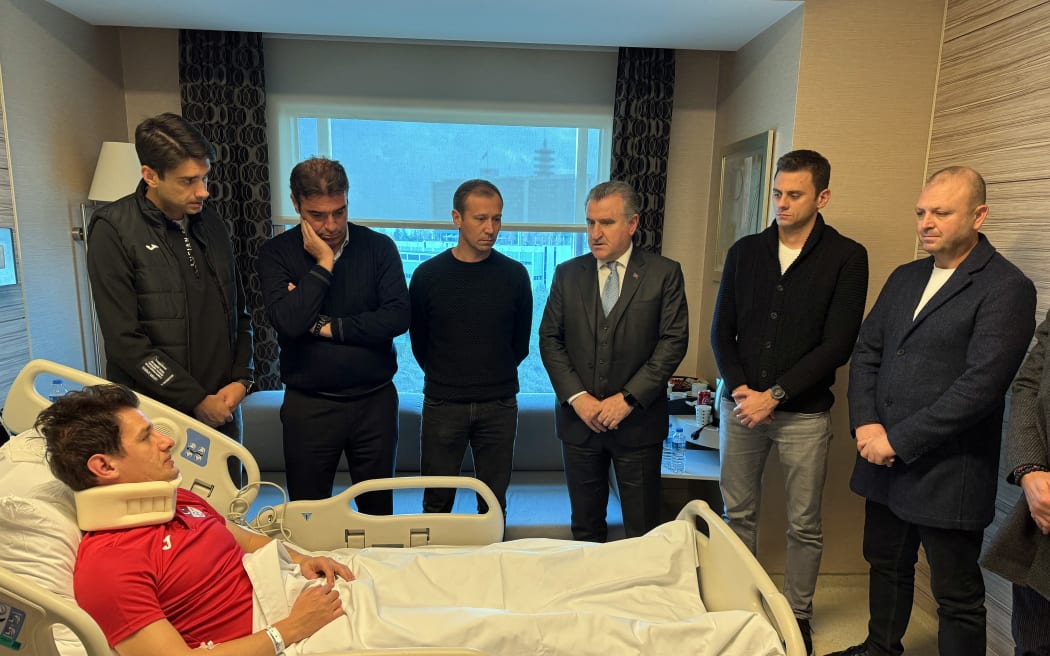 Turkish Minister of Youth and Sports Osman Askin Bak (CR) visiting Turkish referee Halil Umut Meler (bottom) who was hospitalised after being punched by the President of MKE Ankaragucu Football Club, Faruk Koca, in Ankara. 2023.