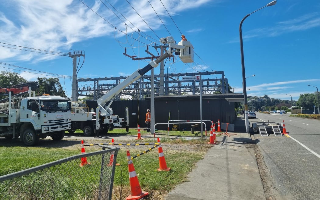 Electrical crews in hi-vis working to repair broken or damaged lines at Taradale Road switching yard.