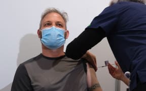 Victorian state chief health officer Brett Sutton receives the AstraZeneca Covid-19 vaccine in Melbourne on April 21, 2021