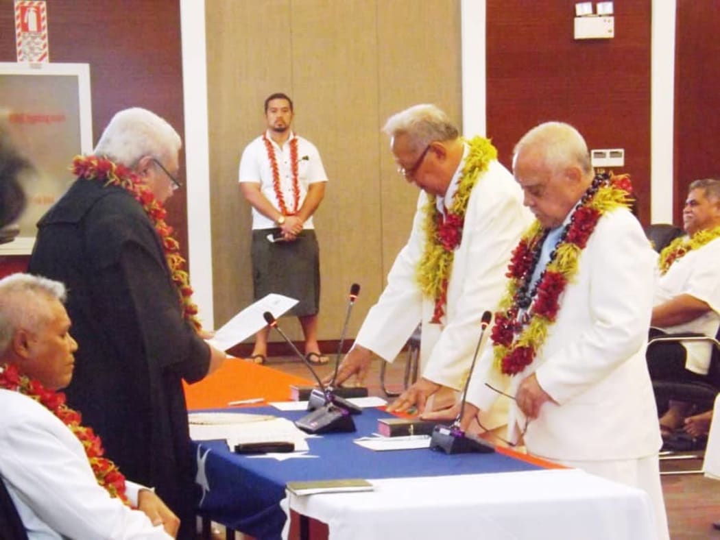Tuiloma Pula Lameko [on the left] being sworn in as a deputy head of state alongisde Le Mamea Ropati