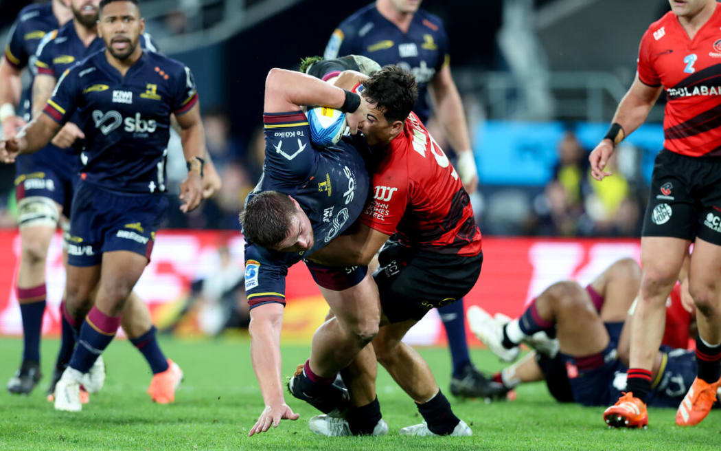 Ethan De Groot is tackled by Noah Hotham.