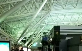 Police evacuated Terminal 8 while they searched for a suspect after the unconfirmed reports.