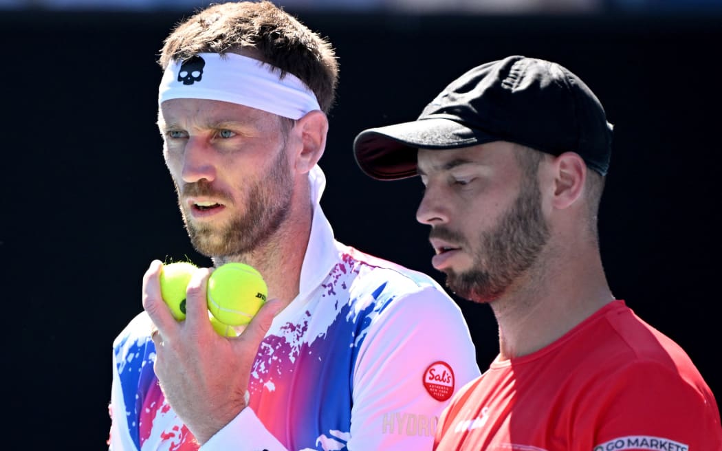 Michael Venus of New Zealand (left) and Tim Puetz of Germany during the Australian Open.