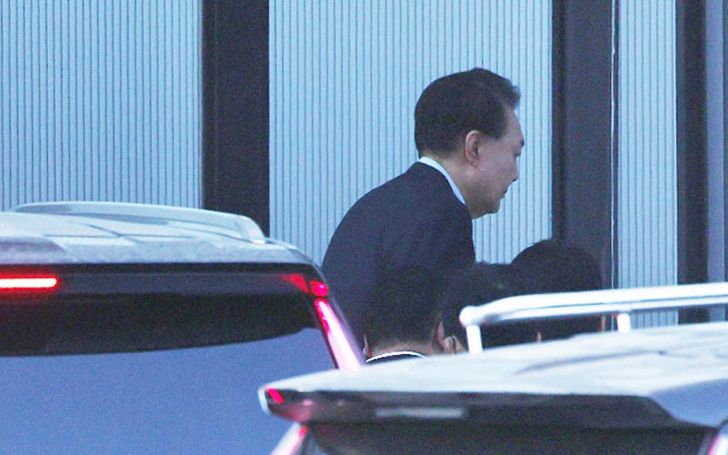 South Korean impeached President Yoon Suk Yeol arrives at the complex building housing the Corruption Investigation Office for High-ranking Officials (CIO) in Gwacheon on 15 January 2025. Yoon said on January 15 that he had decided to submit to questioning over his failed martial law bid to avert "bloodshed" even though he believed the probe was illegal. (Photo by YONHAP / AFP) / - South Korea OUT / NO USE AFTER JANUARY 25, 2025 02:24:56 GMT -  - SOUTH KOREA OUT / NO USE AFTER JANUARY 25, 2025 02:24:56 GMT -  - SOUTH KOREA OUT / NO ARCHIVES -  RESTRICTED TO SUBSCRIPTION USE