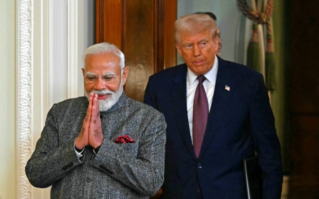 US President Donald Trump and Indian Prime Minister Narendra Modi arrive to hold a joint press conference in the East Room of the White House in Washington, DC, on 13 February, 2025.