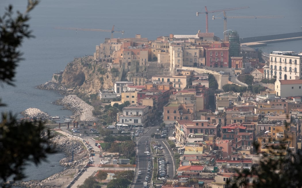 A picture shows the village of Pozzuoli in the Campi Flegrei (Phlegraean Fields) volcanic region on October 13, 2023. There have been many tremors in recent weeks, including two magnitude 4 quakes, the strongest in over 40 years. (Photo by Eliano Imperato / Controluce via AFP)
