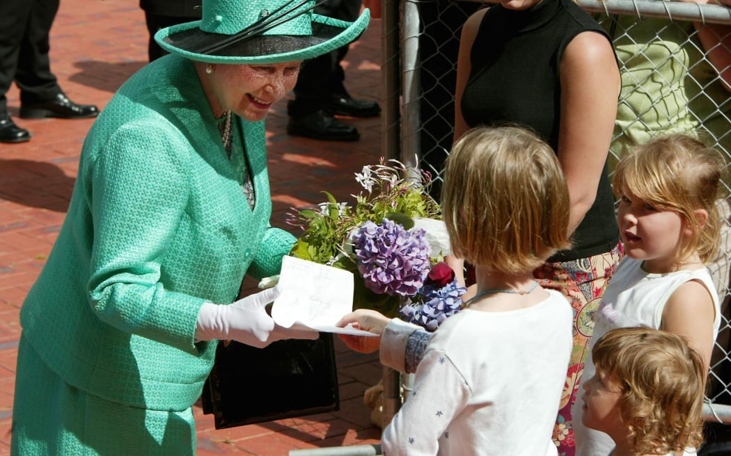 Queen Elizabeth II meets some Kiwi kids during her 2002 tour of New Zealand.