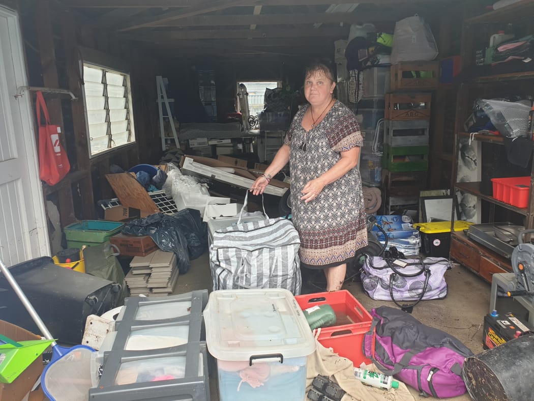 Barker Rd resident Tracey Tasovac returned home for the first time after Monday's storm to find the contents of her garage badly damaged by flood waters.