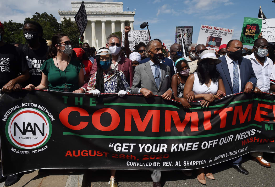 Rev. Al Sharpton (C), Yolanda King (3-R), granddaughter of Martin Luther King Jr., Andrea Waters King (2-R) and Martin Luther King, III (R), march with others on August 28, 2020, in Washington, DC.