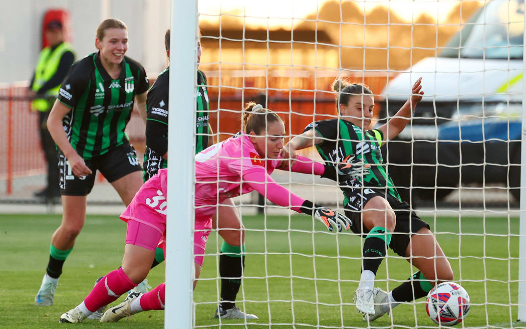Chloe Logarzo of Western United scores a goal against the Wellington Phoenix.