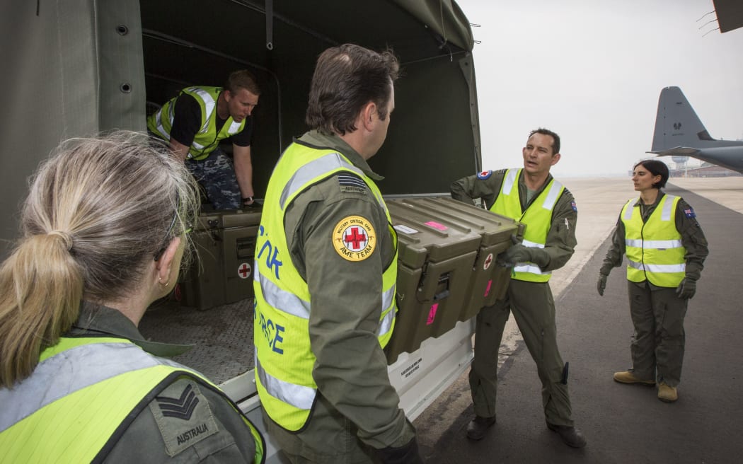 at RAAF Richmond prepare medical equipment to load onto a C-130J Hercules prior to a mission to repatriate Australians who have been injured from the White Island volcanic eruption, at the Royal Airforce Base in Richmond. -