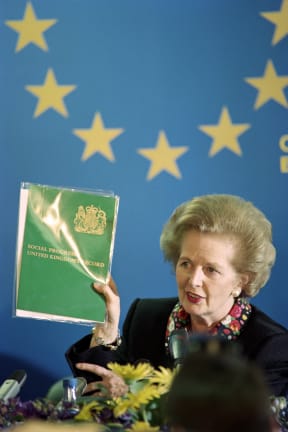 Former British prime minister Margaret Thatcher holds a document, during her press conference at the end of the two-day European Summit in 1989.