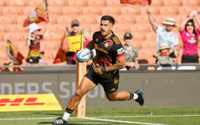 Rameka Poihipi of the Chiefs scores a try against the Rebels at FMG Stadium, Hamilton.