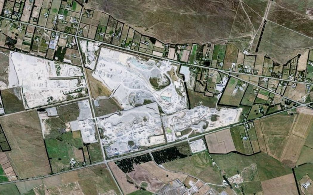 An aerial view of the Winstones quarry on Old West Coast Road, and the houses nearby.