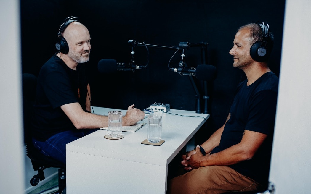 Reverend Frank Ritchie interviewing journalist Justin Latif