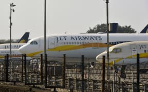 Jet Airways aircraft are seen parked on the tarmac at Chattrapati Shivaji International Airport in Mumbai on March 25, 2019.