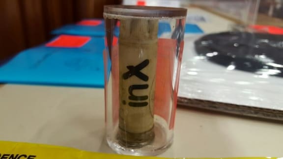 The Crown says this empty gun cartridge found at the WINZ office, with the same 'inX' label Russell Tully's belongings had on them, places him at the scene of the crime.