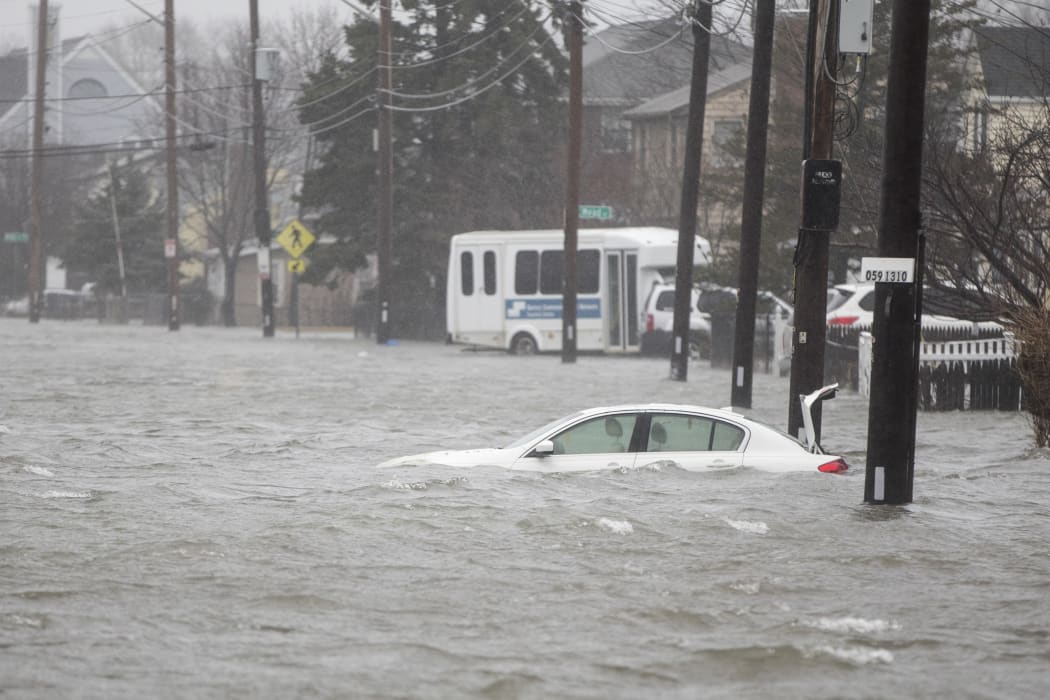 A flooded car sits in Hough's Neck due to a strong coastal storm on March 2, 2018 in Quincy, Massachusetts.