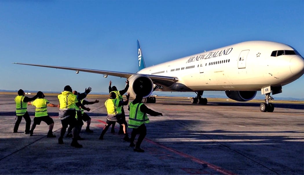 Air New Zealand staff perform a haka on the tarmac to welcome Lorde home.