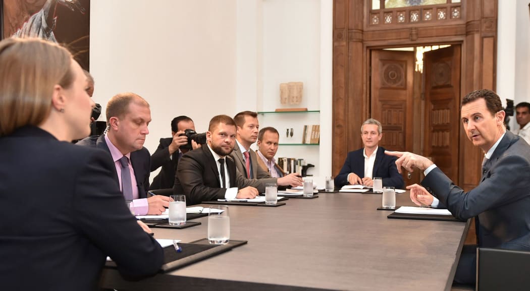 A SANA photo shows President Bashar al-Assad speaking to Russian media on 15 September 2015