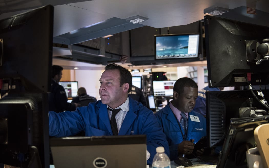 Traders work on the floor of the New York Stock Exchange