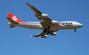 The man risked his life by stowing in the wheel area of a plane believed to be a Cargolux Italia cargo flight.