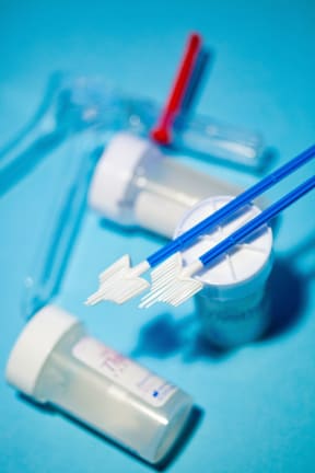 A brush and vials used in vaginal smear testing
