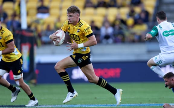 Hurricanes Jordie Barrett runs the ball