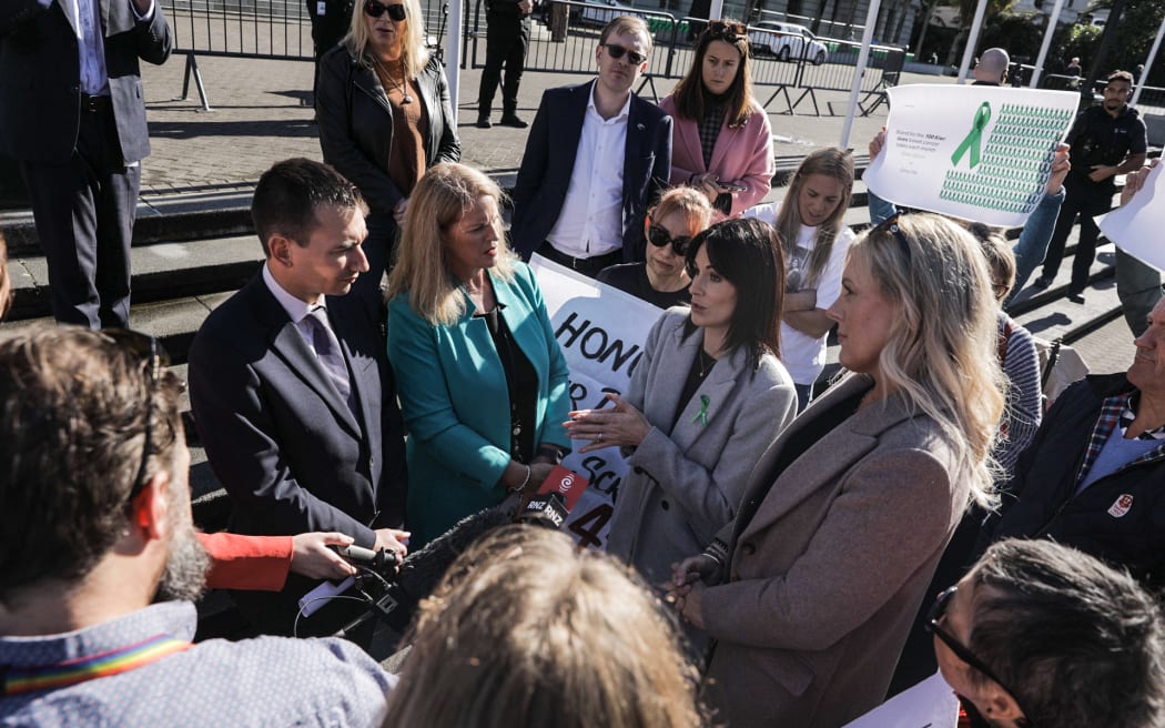 Health Minister Simeon Brown & Social Development Minister Louise Upston speak with bowel cancer protestors outside Parliament