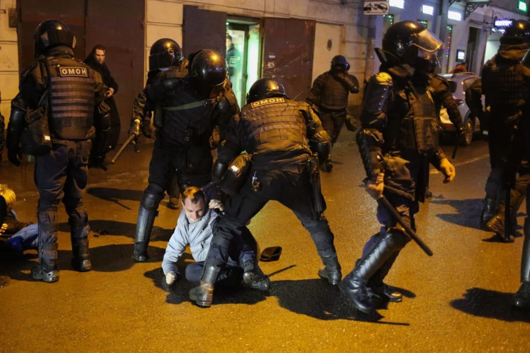 Police officers detain a protester during a rally in support of Alexei Navalny Politica in St. Petersburg, Russia, on January 23, 2021