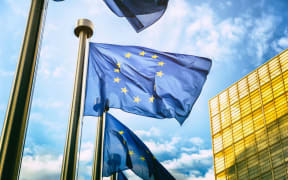 Flags outside the European Commission headquarters in Brussels