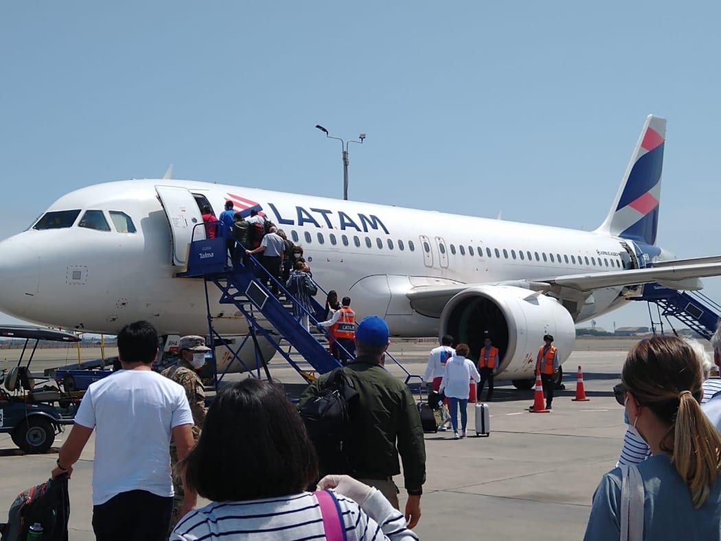 New Zealanders boarding a flight back home after being stranded in Peru due to Covid-19.