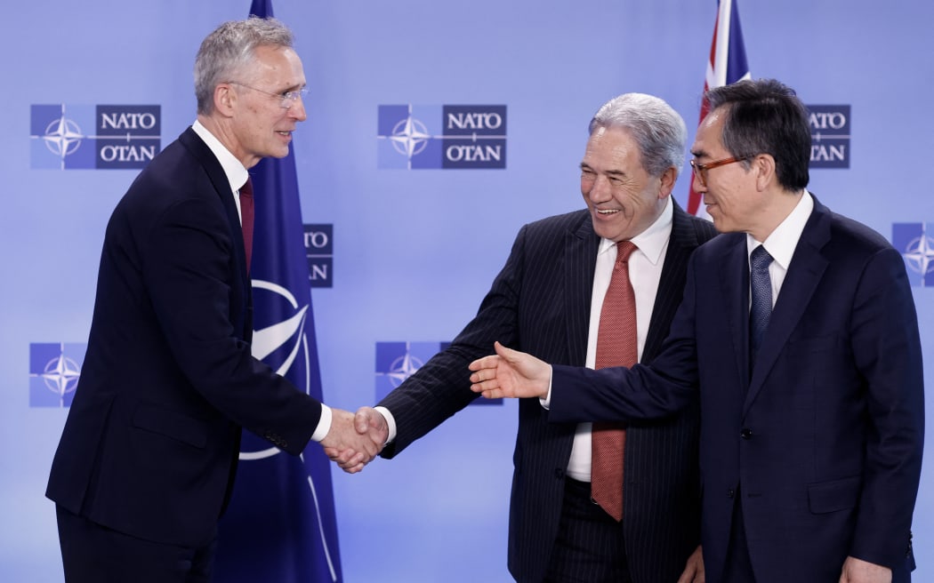 NATO Secretary General Jens Stoltenberg (L) shakes hands with New Zealand's Minister of Foreign Affairs Winston Peters (C) and South Korean Foreign Minister Cho Tae-yul after a photo during a meeting of the North Atlantic Council with Indo-Pacific partners at the NATO Headquarters in Brussels on 4 April, 2024.
