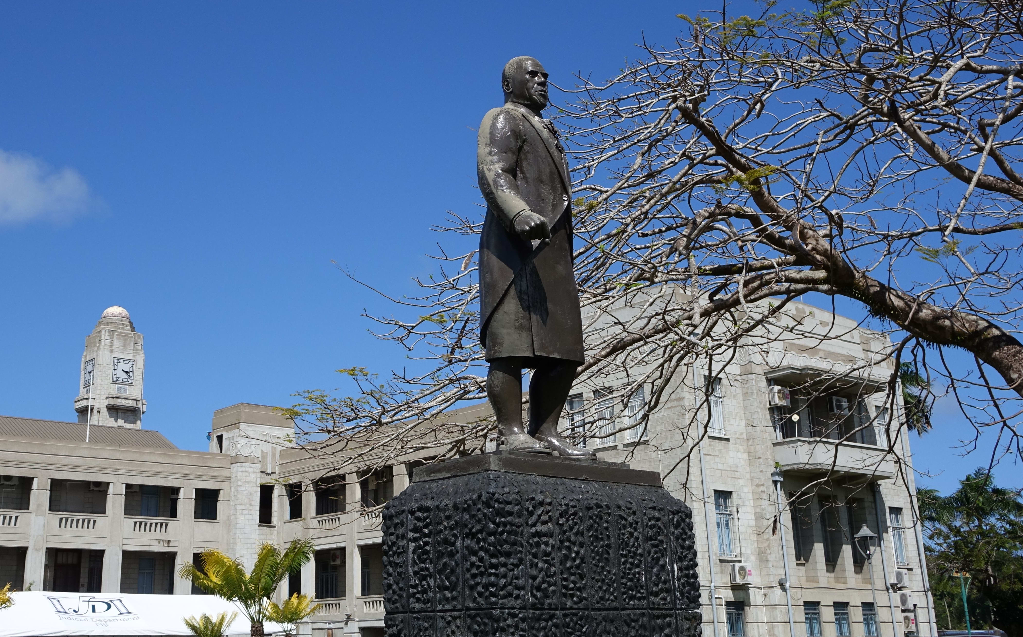 A statue of the Fiji statesman Ratu Sir Lala Sukuna stands guard outside Fiji's government buildings, Suva