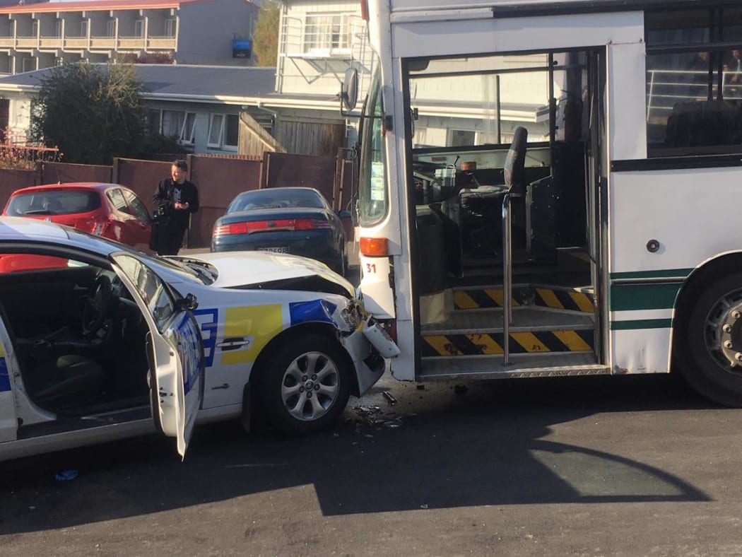 The police car collided with an Otago Road Services school bus.
